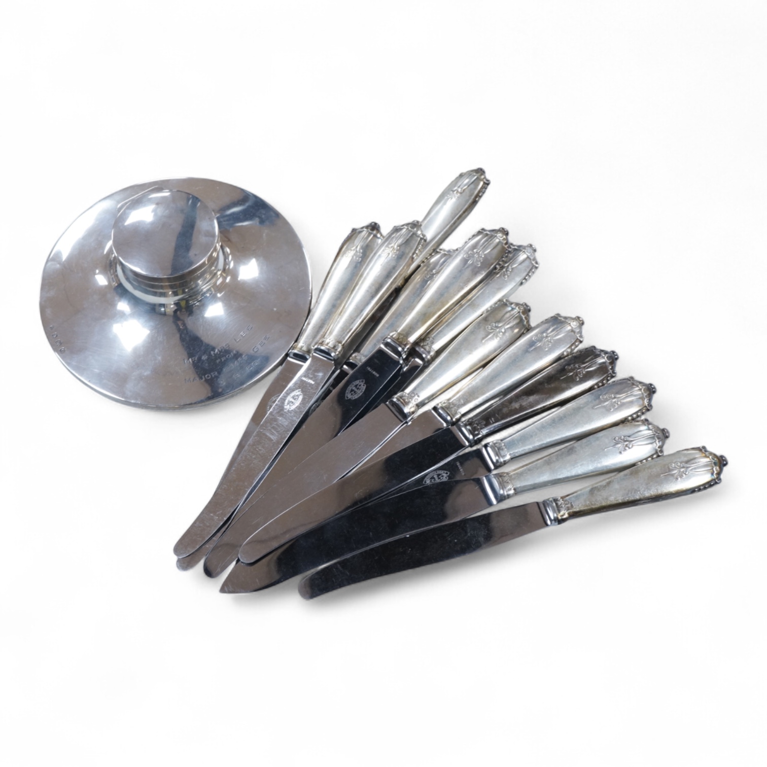 A George V loaded silver capstan-shaped inkwell, mm. W N Ltd, Birmingham 1931, 16.5cm diameter and twelve various Danish loaded silver handled knives with stainless steel blades